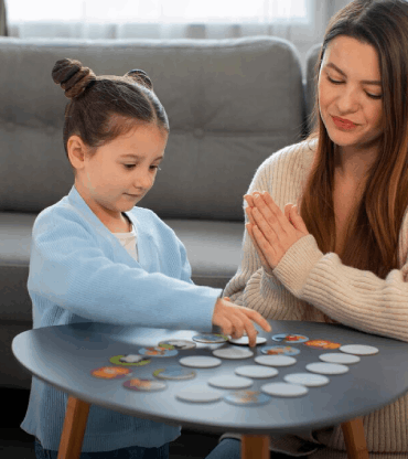 Front view mother and girl playing game